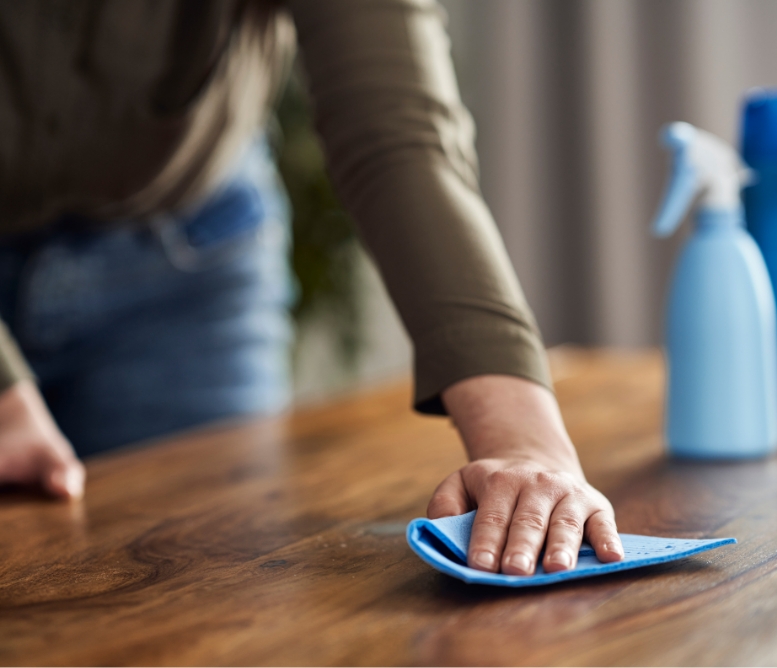 Girl wiping down the table