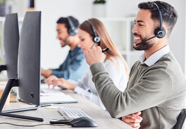 Man working on the phone smiling